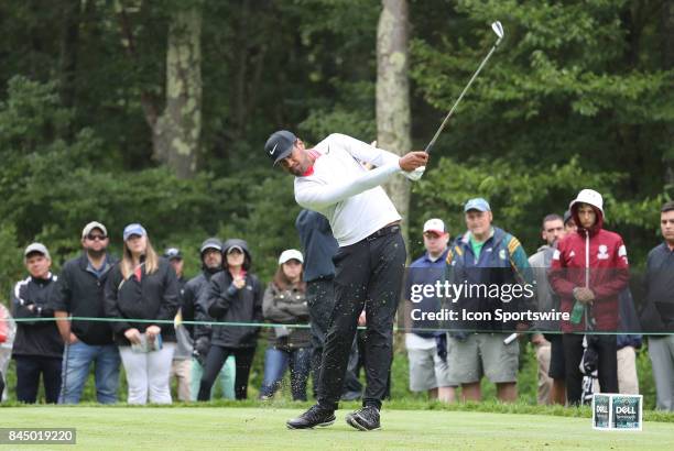 Tony Finau, of the United States, hits from the 8th tee during the third round of the Dell Technologies Championship on September 3 at TPC Boston in...