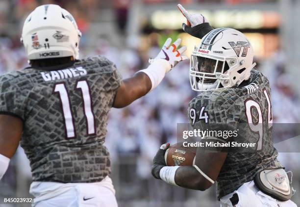 Defensive end Trevon Hill of the Virginia Tech Hokies celebrates his fumble recovery against the Delaware Fightin Blue Hens in the second half at...