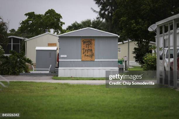 Residents the Sunshine Village mobile home community leave spray painted messages for Hurricane Irma on their trailers September 9, 2017 in Davie,...