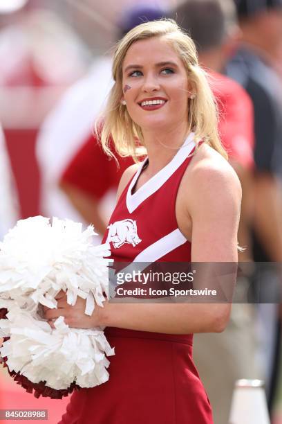 Razorback cheerleader watches the replay during the game between the TCU horned Frogs and the Arkansas Razorbacks on September 9, 2017 at Donald W....