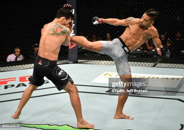 Kajan Johnson of Canada kicks Adriano Martins of Brazil in their lightweight bout during the UFC 215 event inside the Rogers Place on September 9,...