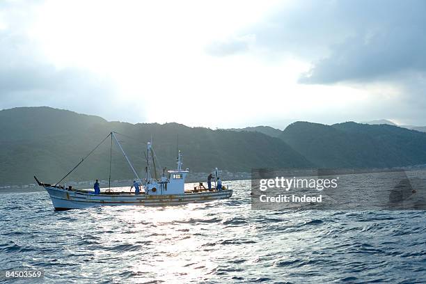 fishing boat on the sea, hokkaido, japan - asian fishing boat stock-fotos und bilder