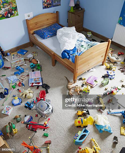 path cleared through toys on floor of childs room - messy foto e immagini stock