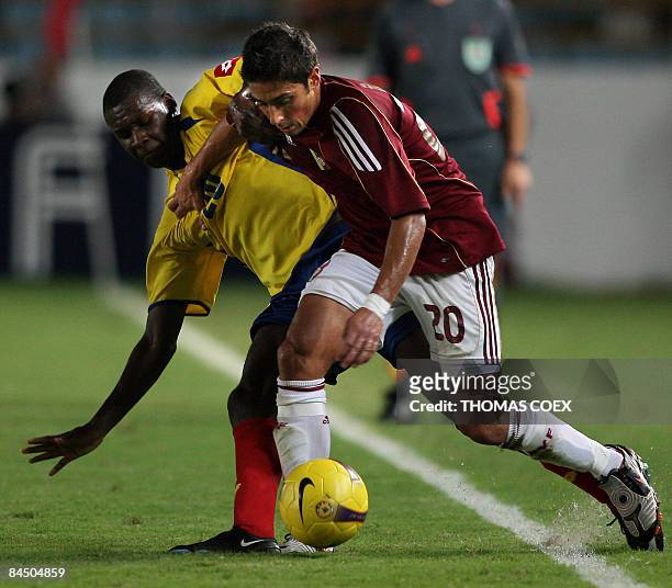 Colombia's midfielder Segundo Victor Ibarbo vies for the ball with Venezuela's Rafael Acosta during their match of the U-20 South American football...