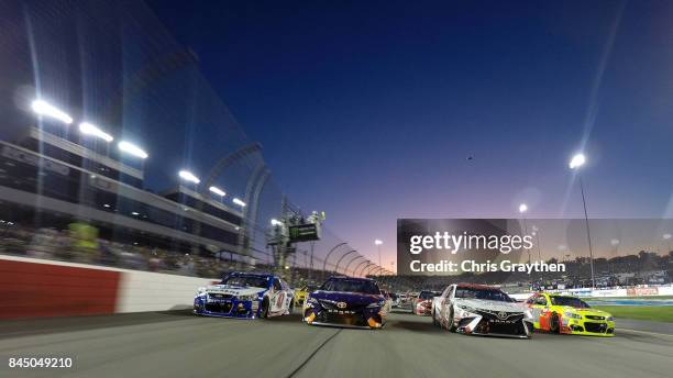 Cars line up four wide in a salute to fans prior to the Monster Energy NASCAR Cup Series Federated Auto Parts 400 at Richmond Raceway on September 9,...