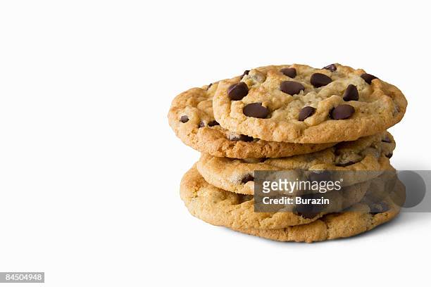stack of chocolate chip cookies - cookie stock pictures, royalty-free photos & images