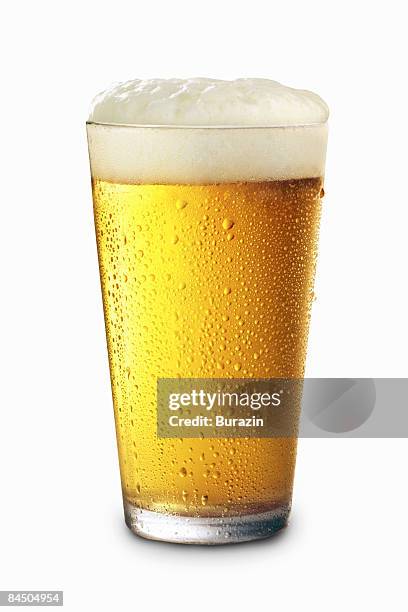 pint glass of beer - beer bubbles stock pictures, royalty-free photos & images