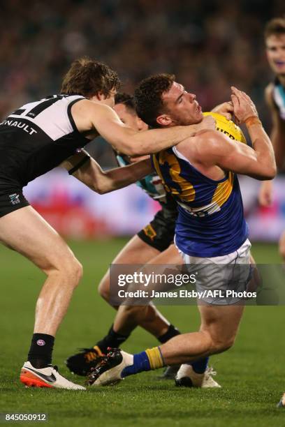 Jared Polec of the Power tackles Luke Shuey of the Eagles and gives away a free during the AFL First Elimination Final match between Port Adelaide...