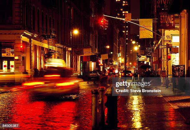 rainy soho new york city street - soho new york stock pictures, royalty-free photos & images