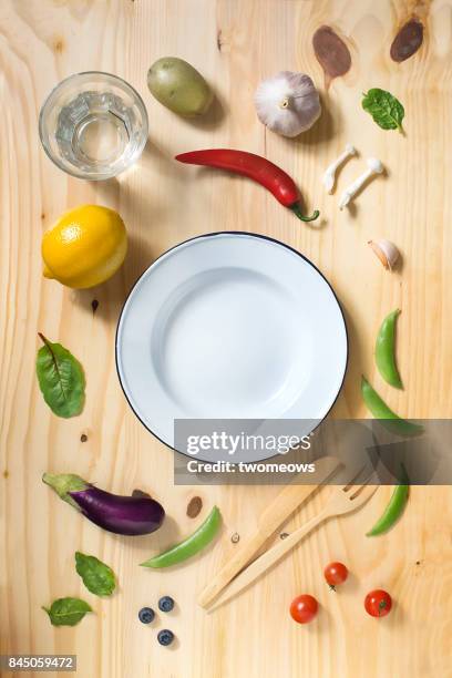 flat lay vegan food on wooden background. - rustic plate overhead photos et images de collection