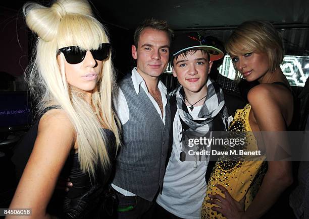 Lady GaGa, Julian Benett, George Sampson and Paris Hilton attend the Nokia 5800 launch party, at Punk on January 27, 2009 in London, England.