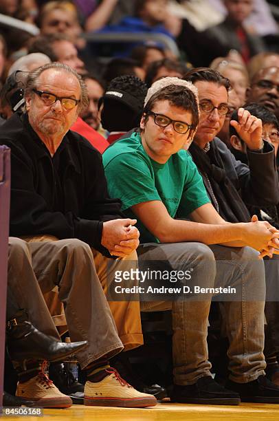 Actor Jack Nicholson and his son Raymond watch a game from courtside between the Charlotte Bobcats and the Los Angeles Lakers at Staples Center on...