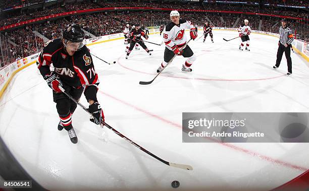 Nick Foligno of the Ottawa Senators stickhandles the puck against Bobby Holik of the New Jersey Devils at Scotiabank Place on January 27, 2009 in...