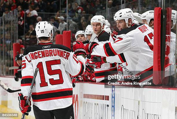 Jamie Langenbrunner of the New Jersey Devils celebrates a goal against the Ottawa Senators at the team bench at Scotiabank Place on January 27, 2009...