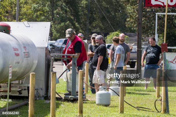 Customers line up for propane refills in preparation for Hurricane Irma at the Ace Hardware September 9, 2017 in Crawfordville, Florida. Current...