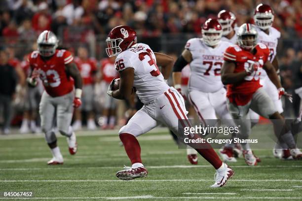Dimitri Flowers of the Oklahoma Sooners runs with the ball on his way to scoring a 36-yard touchdown during the third quarter against the Ohio State...