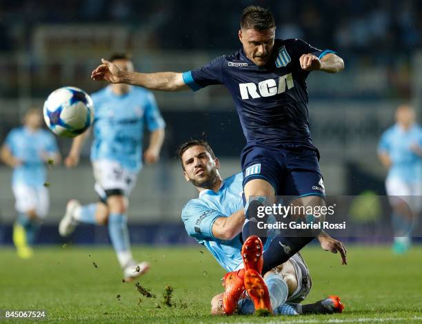 Ivan Pillud of Racing Club fights for the ball with Ramiro Costa of Temperley during a match between Racing Club and Temperley as part of the...