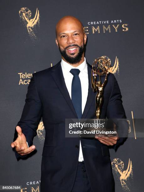 Hip-hop artist Common poses in the press room with the award for outstanding original music and lyrics for "13th Song Title: Letter to the Free"...