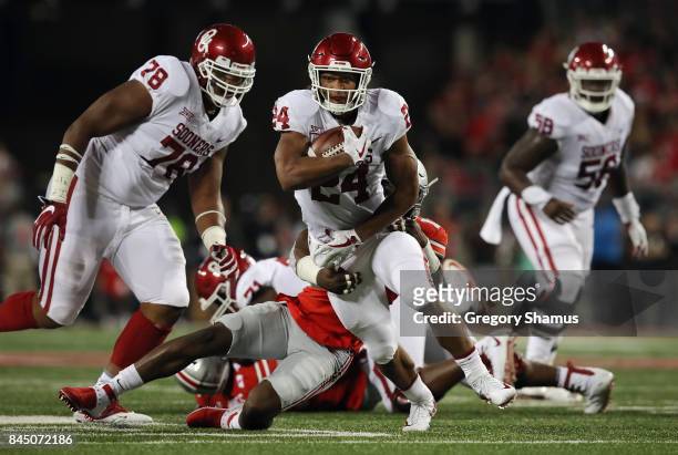 Rodney Anderson of the Oklahoma Sooners runs with the ball during the first half against the Ohio State Buckeyes at Ohio Stadium on September 9, 2017...