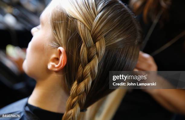 Models prepare backstage during the Christian Siriano collection during the September 2017 New York Fashion Week: The Shows at Pier 59 on September...