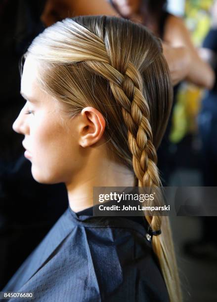 Models prepare backstage during the Christian Siriano collection during the September 2017 New York Fashion Week: The Shows at Pier 59 on September...