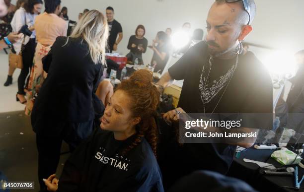 Models prepare backstage during the Christian Siriano collection during the September 2017 New York Fashion Week: The Shows at Pier 59 on September...