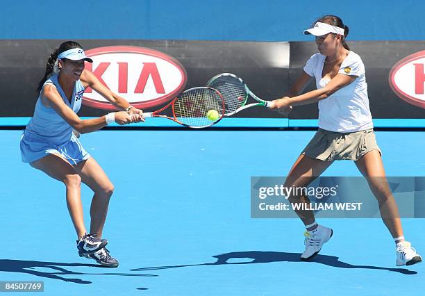Peng Shuai of China and partner Hsieh Su-Wei attempt to return the ball to Venus and Serena Williams of the US during their women's doubles tennis...