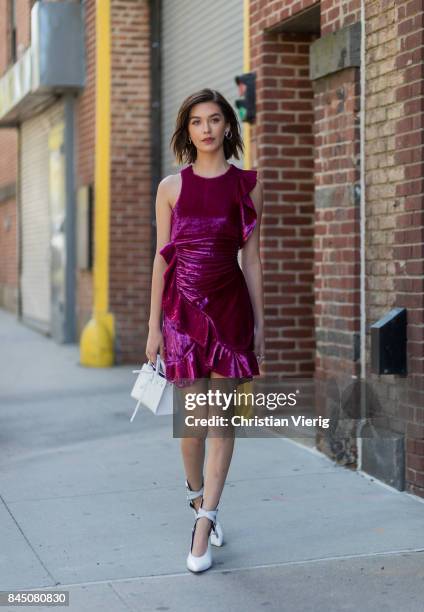 Amanda Steele wearing a purple dress seen in the streets of Manhattan outside Self-Portrait during New York Fashion Week on September 9, 2017 in New...