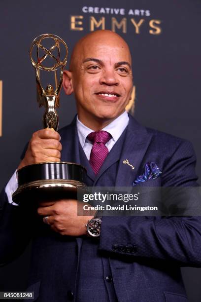 Music producer Rickey Minor poses in the press room with the award for outstanding music direction for "Stayin' Alive: A Grammy Salute to the Music...