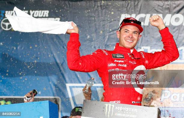 Kyle Larson, driver of the Target Chevrolet, celebrates in Victory Lane after winning the Monster Energy NASCAR Cup Series Federated Auto Parts 400...