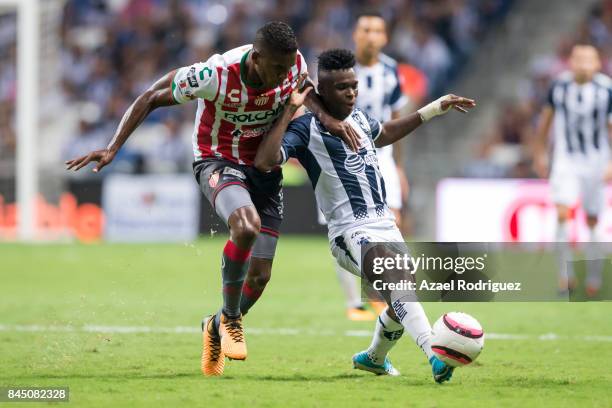 Aviles Hurtado of Monterrey fights for the ball with Brayan Beckeles of Necaxa during the 8th round match between Monterrey and Necaxa as part of the...