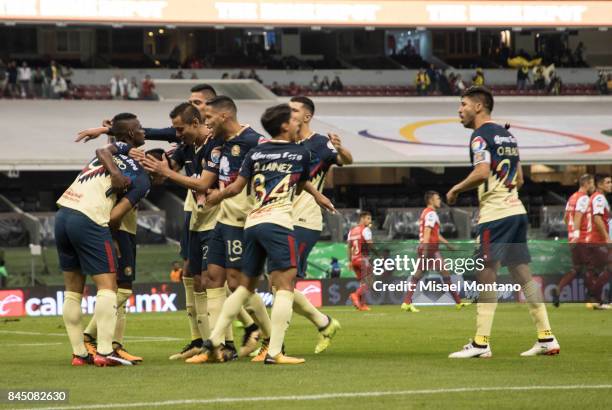 Silvio Romero of America celebrates with teammates after scoring the first goal of his team during the 8th round match between America and Veracruz...