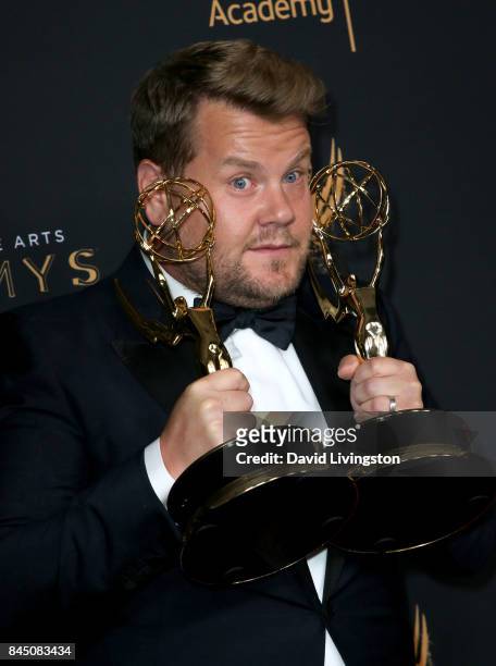 Comedian James Corden poses in the press room with the award for outstanding special class program for "70th Annual Tony Awards" during the 2017...