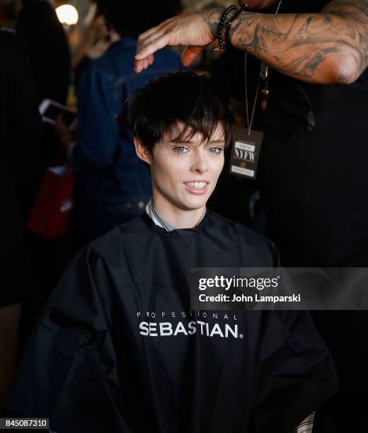 Coco Rocha prepares backstage during the Christian Siriano collection during the September 2017 New York Fashion Week: The Shows at Pier 59 on...