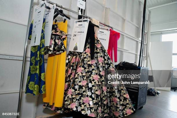 Fashions hang backstage during the Christian Siriano collection during the September 2017 New York Fashion Week: The Shows at Pier 59 on September 9,...