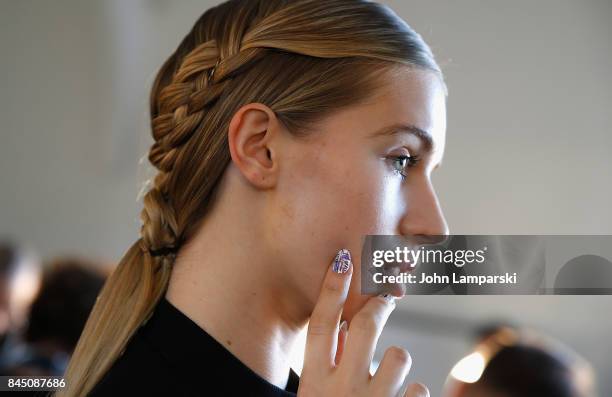 Models prepare backstage during the Christian Siriano collection during the September 2017 New York Fashion Week: The Shows at Pier 59 on September...