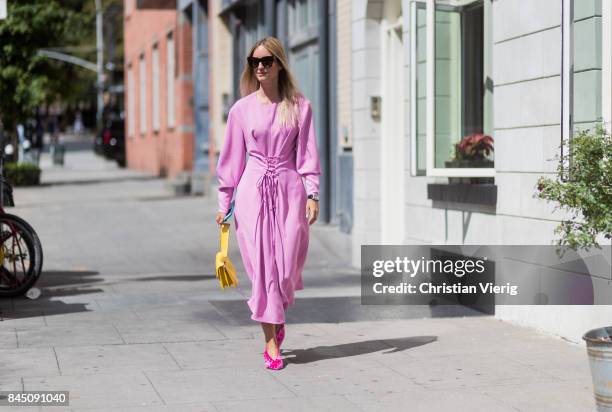 Charlotte Groeneveld wearing a pink dress seen in the streets of Manhattan outside Tibi during New York Fashion Week on September 9, 2017 in New York...