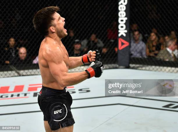 Henry Cejudo celebrates his knockout victory over Wilson Reis of Brazil in their flyweight bout during the UFC 215 event inside the Rogers Place on...