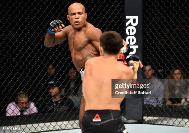 Wilson Reis of Brazil kicks Henry Cejudo in their flyweight bout during the UFC 215 event inside the Rogers Place on September 9, 2017 in Edmonton,...