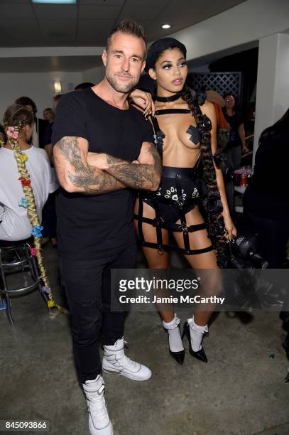 Designer Philipp Plein poses with a model backstage for the Philipp Plein fashion show during New York Fashion Week: The Shows at Hammerstein...