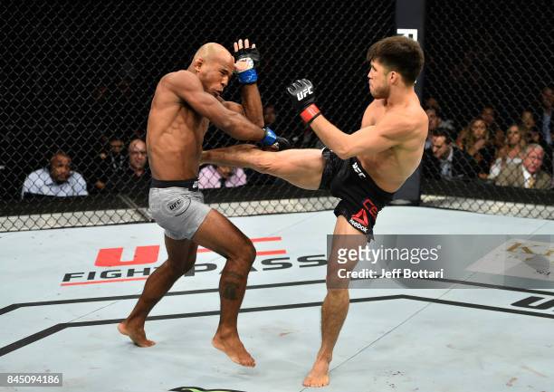 Henry Cejudo kicks Wilson Reis of Brazil in their flyweight bout during the UFC 215 event inside the Rogers Place on September 9, 2017 in Edmonton,...