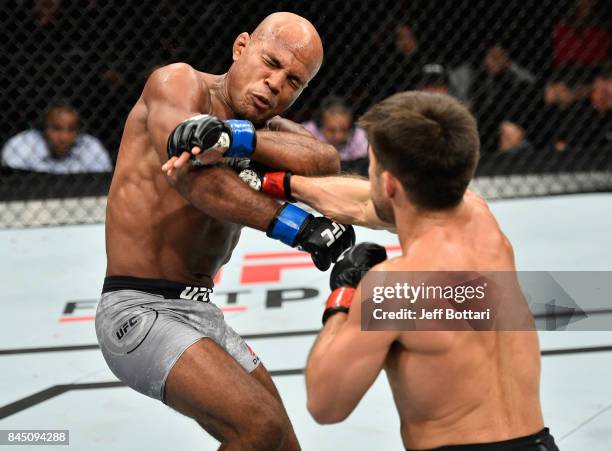 Henry Cejudo punches Wilson Reis of Brazil in their flyweight bout during the UFC 215 event inside the Rogers Place on September 9, 2017 in Edmonton,...