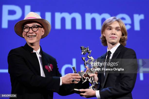 Charlie Plummer receives the 'Marcello Mastroianni' Award for Best New Young Actor or Actress for 'Lean On Pete' from jury member Yonfan during the...
