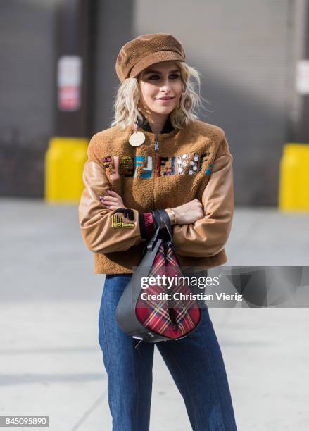 Caroline Daur wearing Fendi jacket, flat cap, Loewe bag seen in the streets of Manhattan outside Jonathan Simkhai during New York Fashion Week on...