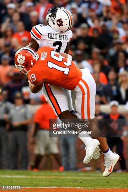 Safety Tanner Muse of the Clemson Tigers hits wide receiver Nate Craig-Myers of the Auburn Tigers as he brings in the football for a reception...