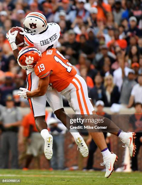 Safety Tanner Muse of the Clemson Tigers hits wide receiver Nate Craig-Myers of the Auburn Tigers as he brings in the football for a reception...