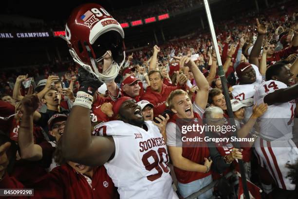 Neville Gallimore of the Oklahoma Sooners celebrates with fans after defeating the Ohio State Buckeyes 31-16 at Ohio Stadium on September 9, 2017 in...