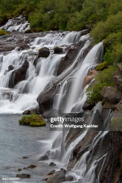 View of Hraunfossar - Lava Falls - in west Iceland are beautiful and unusual natural phenomena with clear, cold springs of subterranean water seep...