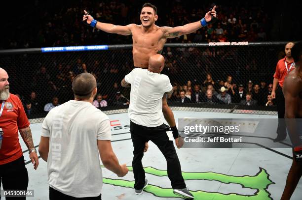 Rafael Dos Anjos of Brazil celebrates his submission victory over Neil Magny in their welterweight bout during the UFC 215 event inside the Rogers...