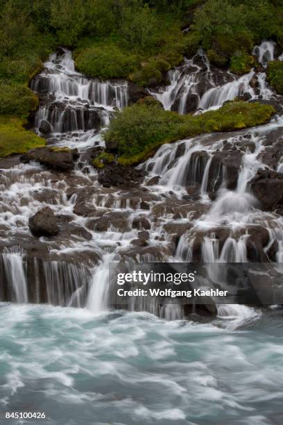 View of Hraunfossar in west Iceland are beautiful and unusual natural phenomena with clear, cold springs of subterranean water seep through the lava...